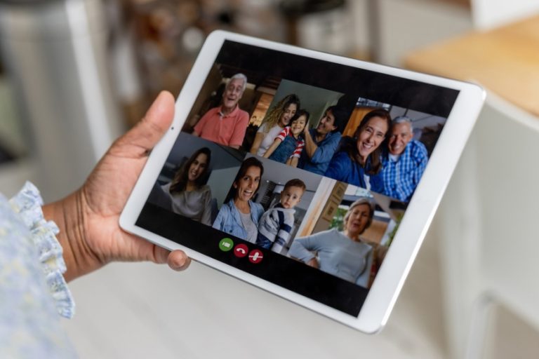 Family on a tablet screen on a video call.